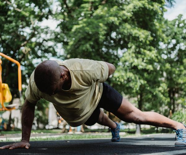 Man doing a plank exercise, symbolizing a strong foundation.
